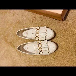 White and gold loafers